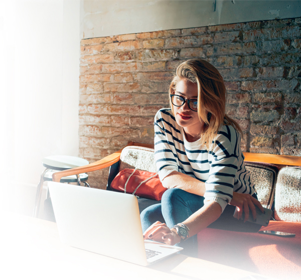 Woman on laptop in cafe